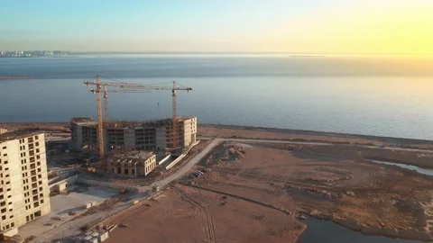 Flying a drone over an apartment building under construction. Stock Footage 185472371