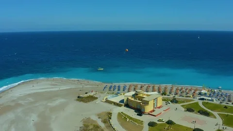 Flying on a drone over a beautiful beach with turquoise water and shoreline with 스톡 동영상 118897828