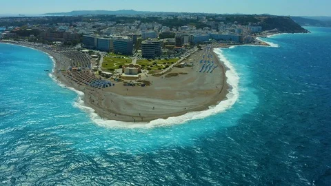 Flying on a drone over a beautiful beach with turquoise water and shoreline with Stock-Footage 118900221