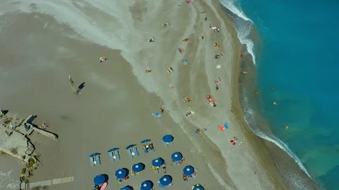 Flying on a drone over a beautiful beach with turquoise water and shoreline with Stock-Footage 118902791