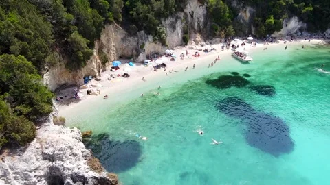Flying a drone over a beautiful beach Video stock 243089752