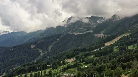 Flying drone over beautiful mountains among clouds. Vidéo 150307735