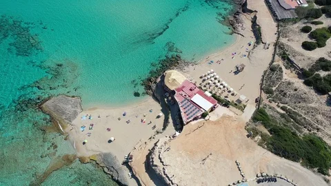 Flying with Drone over beautiful natural beach on Ibiza Stock Footage