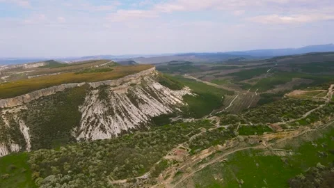 Flying a drone over the cave old city and its buildings. Stock Footage 254048259