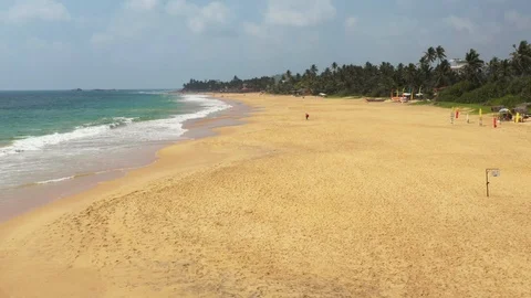 Flying a drone over the coast and Islands on the ocean at dawn. Big wave. Sunny  Stock Footage 104856208
