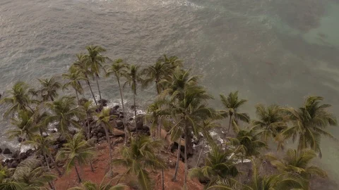 Flying a drone over the coast and Islands on the ocean at dawn. Big wave. Sunny  Stock Footage 104857438