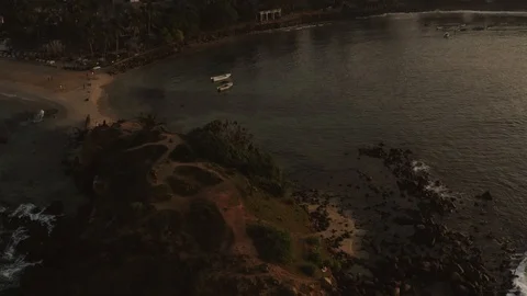 Flying a drone over the coast and Islands on the ocean at dawn. Big wave. Sunny  Stock Footage 104857462