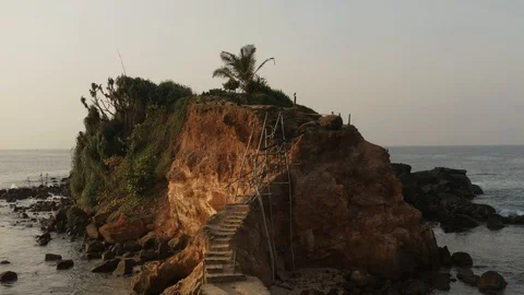 Flying a drone over the coast and Islands on the ocean at dawn. Big wave. Sunny  Stock Footage 104857514