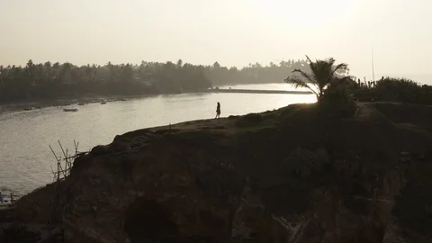 Flying a drone over the coast and Islands on the ocean at dawn. Big wave. Sunny  Stock Footage 104857515