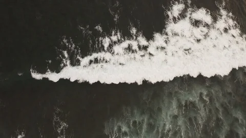 Flying a drone over the coast and Islands on the ocean at dawn. Big wave. Sunny  Stock Footage 104857528