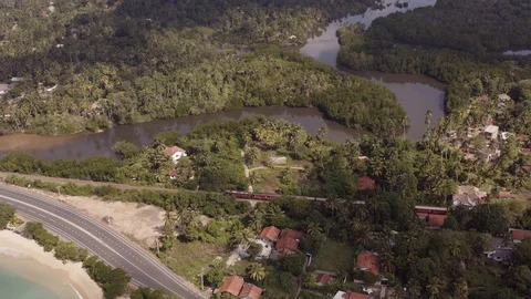 Flying a drone over the coast and Islands on the ocean at dawn. Big wave. Sunny  Stock Footage 104857582