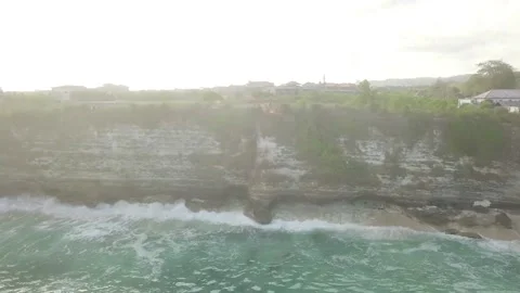 Flying drone over the edge of the mountain and the blue sea. Stock Footage 155998591