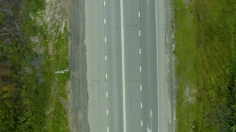 Flying on drone over a high-speed highway and cars on it driving at high speed Video stock 134952438