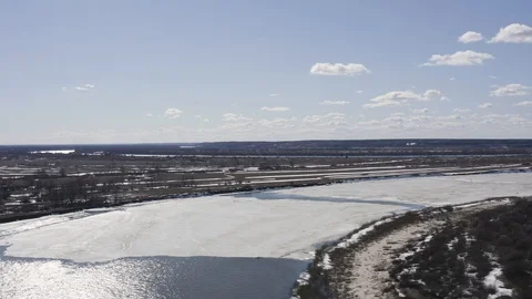 Flying drone over the ice floating on the river Oka Stock Footage 111974829