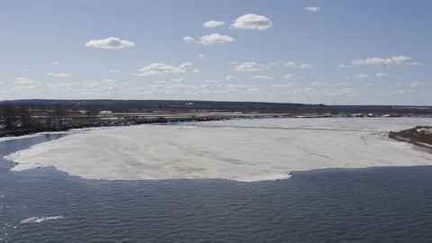 Flying drone over the ice floating on the river Oka Stock Footage 111974864