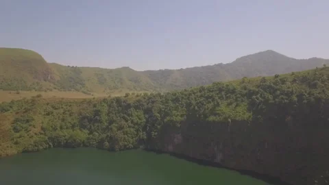 Flying a drone over the lake in the Melong region, Cameroon Stock Footage 260904096