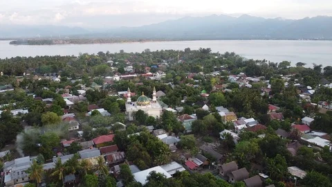 Flying with Drone over Mosque at the beautiful island Gili Air near Lombok Stock Footage 124783748