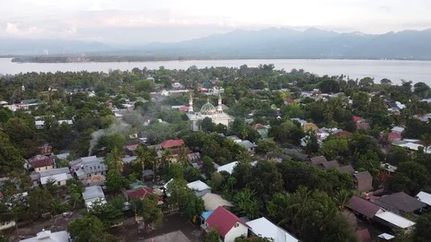 Flying with Drone over Mosque at the beautiful island Gili Air near Lombok Stock Footage 124783754