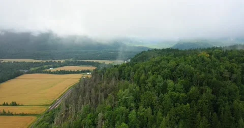 Flying drone over mountains and fields in Canada Video stock 204091296