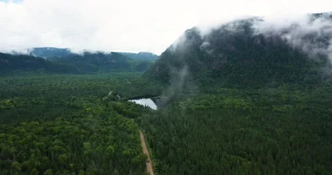 Flying drone over mountains and lakes in Canada Video stock 204091496