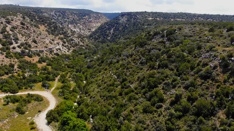 Flying on drone over the mountains of Cyprus near the sea. Avakas Reserve Video stock 110859990