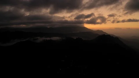 Flying on a drone over the mountains in the dawn. Big rocks. Tea plantations. Su Stock Footage 104691950