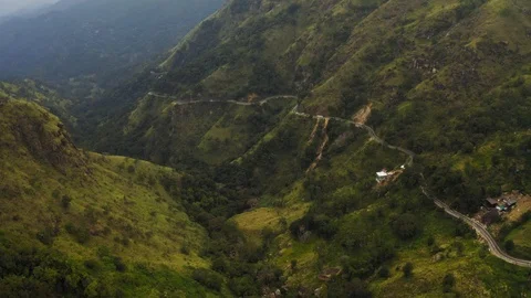 Flying on a drone over the mountains with tea plantations. Big rocks. Sunny weat Stock Footage 104857656
