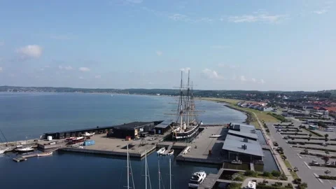 Flying with Drone over museum ship HDMS Jylland (wooden ship) in Ebeltoft and Stock Footage 162336672