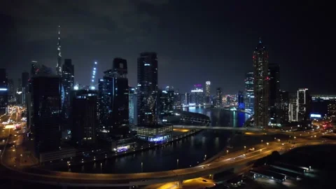 Flying a drone over a night Dubai. Aerial view Stock Footage 209130309