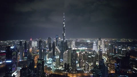 Flying a drone over a night Dubai. Aerial view Video stock 209136500