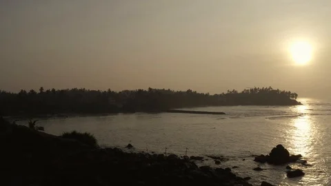 Flying on a drone over the ocean at dawn. Sunny weather. Sri Lanka Stock Footage 104691958