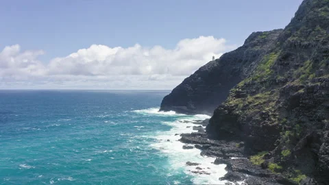 Flying drone over the ocean. View of makapuu lighthouse. Waves of Pacific Ocean Stock Footage 153250303