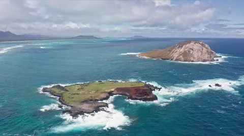 Flying drone over the ocean. View of Rabbit Island. Waves of Pacific Ocean wash Stock Photos