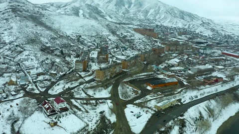 Flying a drone over the river, bridge and mountains of the city of Ust Kamenogor 스톡 동영상 240529799
