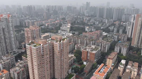 Flying drone over the roofs of multi-storey residential buildings. Stock Footage 117888760