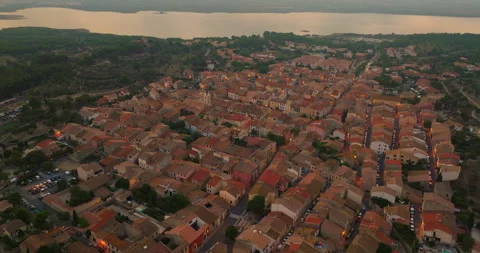 Flying a drone over the rooftops of a small tourist town in the south of France Video stock 254071622