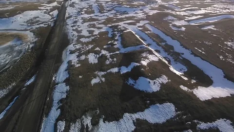 Flying on the drone over the spring land and snow. Stock Footage 106009293
