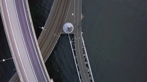 Flying by drone over a stretch of roads on the water Stock Footage 158515189