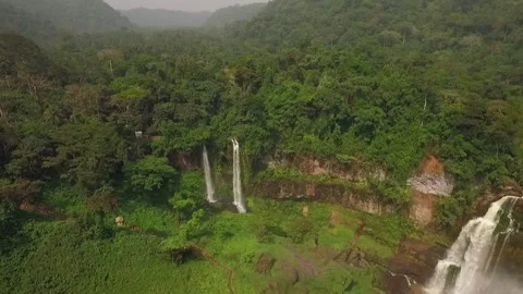 Flying a drone over a waterfall in the Melong region, Cameroon Stock Footage 258372051
