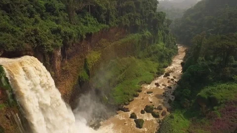 Flying a drone over a waterfall in the Melong region, Cameroon Stock Footage 258373272