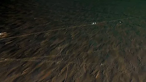 Flying on the drone over the winter like and two fishermen. Stock Footage 103422125