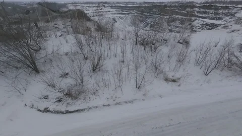 Flying on the drone over the winter road and quarry. Stock Footage 103239077