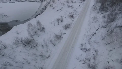 Flying on the drone over the winter road and quarry. Stock Footage 103267628