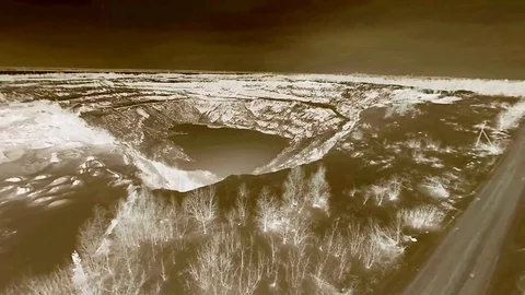 Flying on the drone over the winter road and quarry. Negative. Stock Footage 103421195