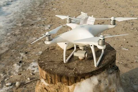 Flying drone quadcopter Dji Phantom 4 with high resolution digital camera. Stock Photos