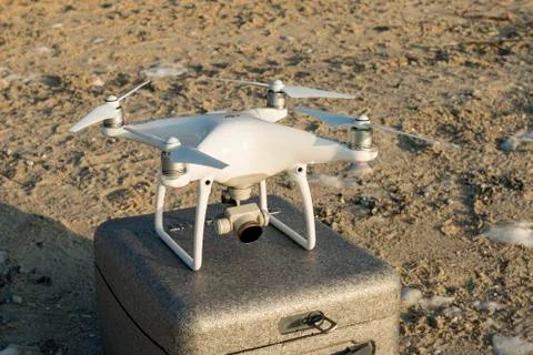 Flying drone quadcopter Dji Phantom 4 with high resolution digital camera. Stock Photos