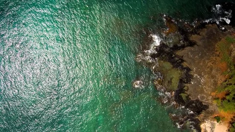 Flying drone rotating above the ocean Stock Footage 128965197