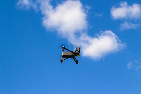 Flying drone  in the sky. Stock Photos