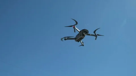 Flying drone with stabilizer camera on the sky 4k Stock Footage 75639244