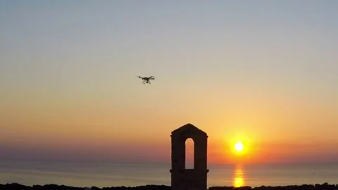 Flying drone at sunset slow motion 動画素材 79831673